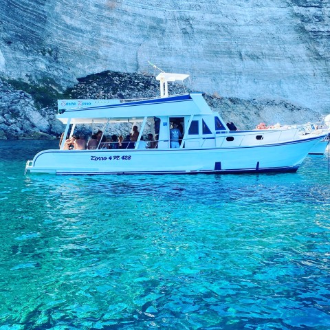 Visit Lampedusa Boat Cruise with Swimming Stops and Italian Lunch in Lampedusa, Italy