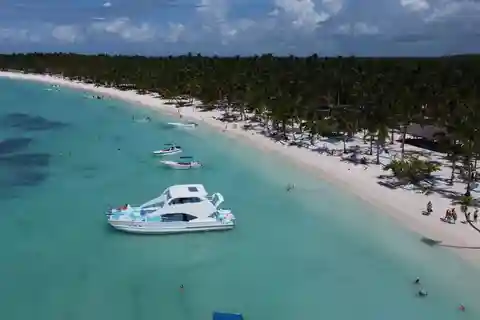 From Punta Cana: Saona and Mano Juan Day Trip by Catamaran