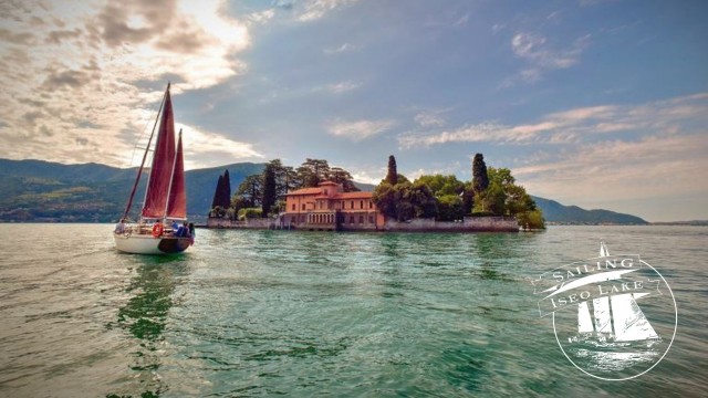 Visit Iseo Lake tours on a historic sailboat in Bossico, Lombardy, Italy