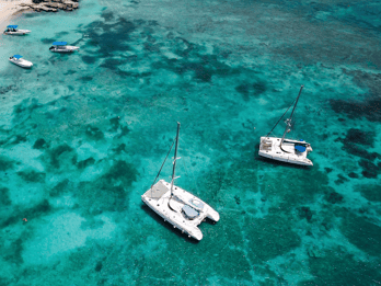 Paros: Private Catamaran Cruise with Meal, Drinks & SUP
