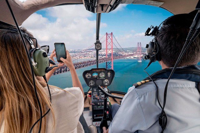 Visit Lisbon Helicopter Ride, Boat Trip, & Old Town Walking Tour in Lisbona
