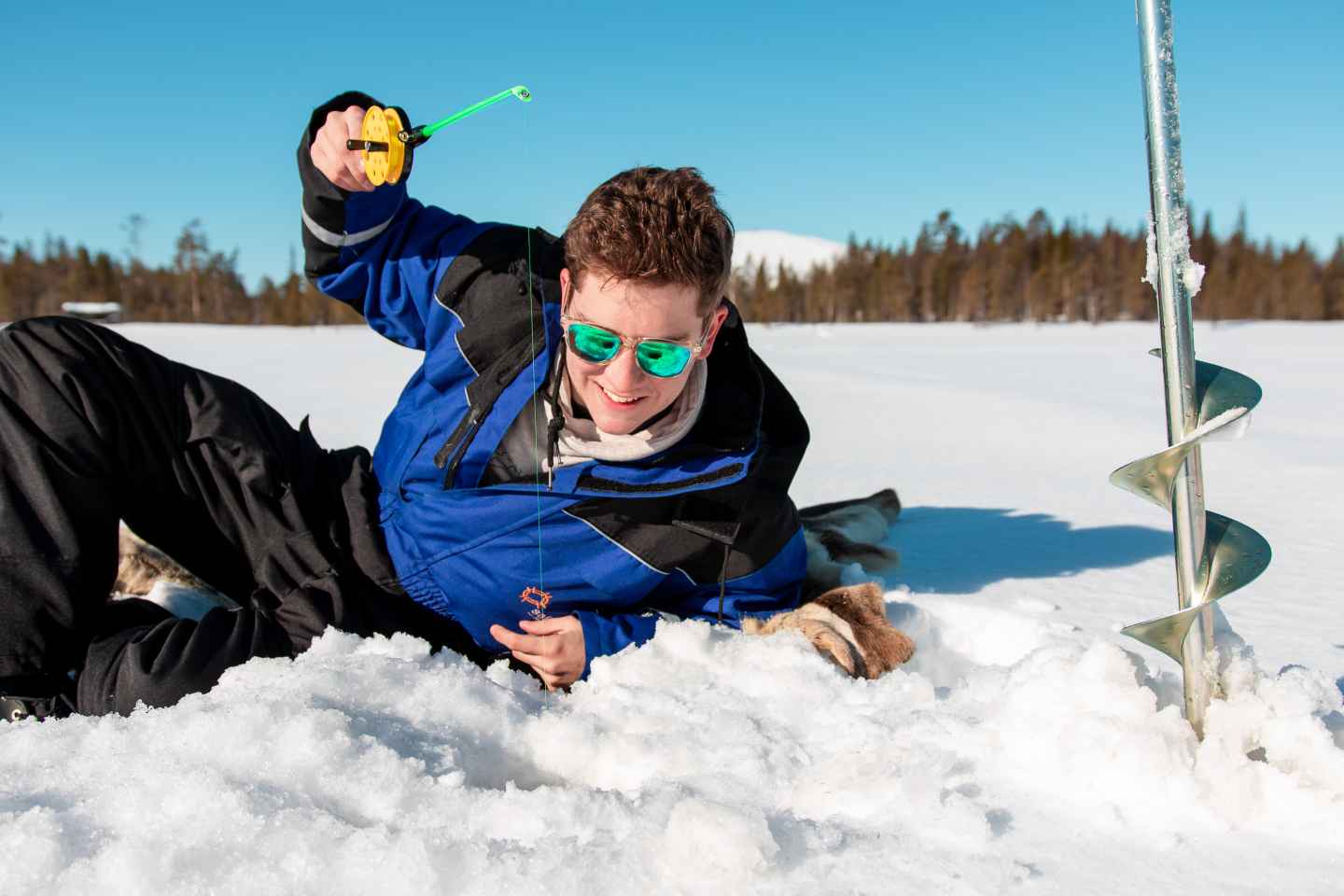 Ylläs: Snowmobile Adventure with Ice Fishing