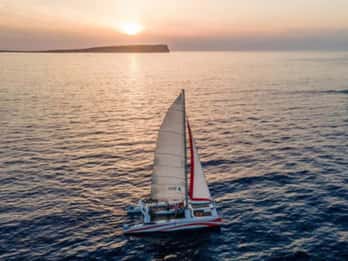 Fornells: Catamaran Sunset Cruise of Menorca's Coast