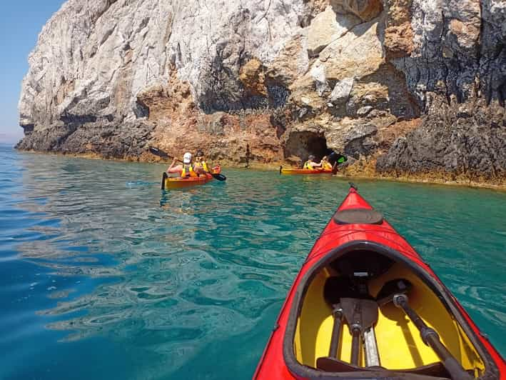 Sunset Sea Kayaking Inside the Caves of Faliraki | GetYourGuide