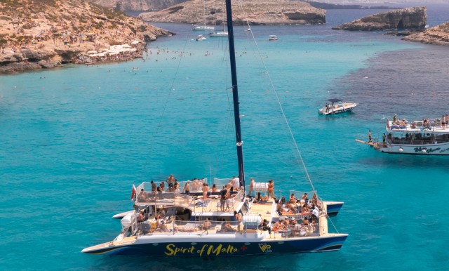 Visit Comino Blue Lagoon Catamaran Cruise with Lunch and Open Bar in Golden Bay, Malta