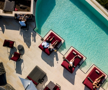 Daybed Relaxation with infinity pool use with caldera views