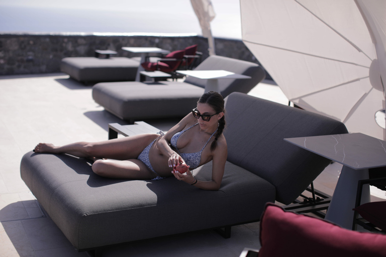 Daybed Relaxation with infinity pool use with caldera views