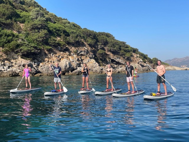 Visit Golfo Aranci tour SUP Paddleboard dolphin aperitif breckfast in Olbia, Italy