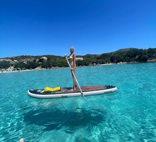Visit San Teodoro Stand Up Paddleboard Tour with a Snack in Olbia, Italy