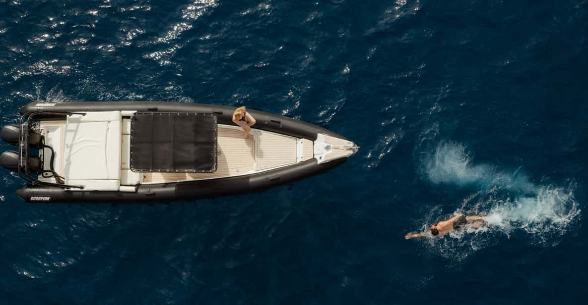 One man in a boat, Santorini, Row, row, row your boat