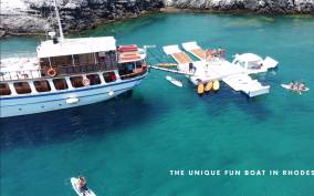 Rhodes: Boat Cruise with Food, Drinks, SUP, Kayak & Swimming