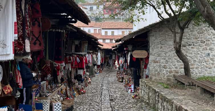 Albanian souvenirs and traditional costumes for sale at Kruja castle.