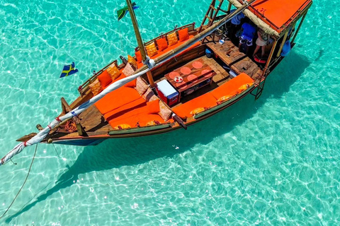 Mnemba Island Dhow Snorkeling, Dolphins, Bbq Lunch, Sailing Sharing Mnemba Island Snorkeling Trip with Bbq Lunch