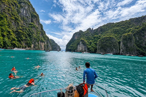 From Phi Phi: Iconic Bays by Longtail—Beach, Lagoon, Snorkel Phi Phi: Longtail Join Trip — Bays, Beach & Snorkeling