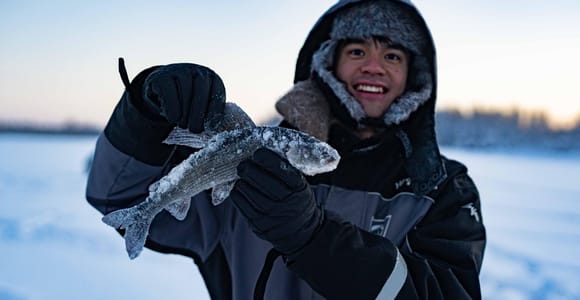 Rovaniemi: Ice Fishing on a Frozen Lake with BBQ and Photos