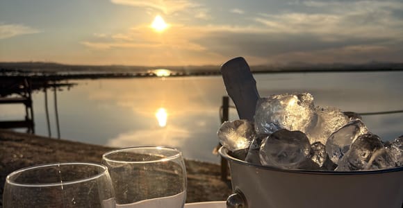 Pink-toned salt water beneath a pale sunset sky on the southern Costa Blanca