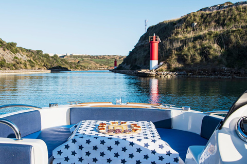 Menorca: Passeio de barco privado com aperitivo e pôr do sol