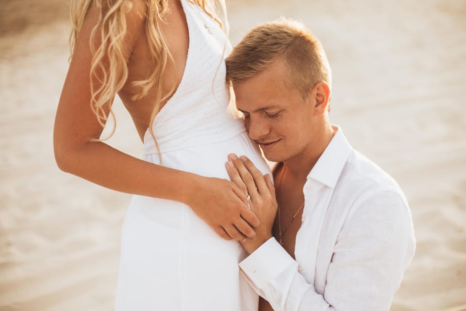 Dubai maternity photoshoot at the beach GetYourGuide