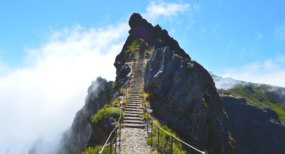 Stone steps climbing between volcanic cliffs on a high Madeira mountain trail