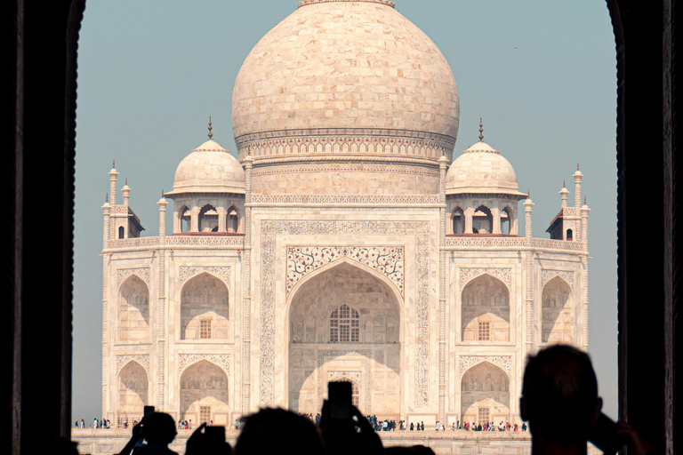 From Delhi: Sunrise Taj Mahal & Agra Fort Day Trip by AC Car Tour Guide Services Only