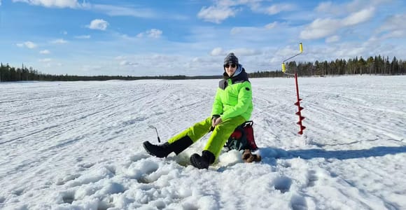 Levi: Snowmobile and Ice Fishing Safari with Campfire Snacks