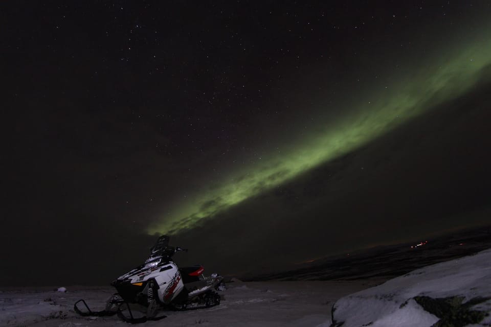 Aurora Hunt on Snowmobile - small groups | GetYourGuide