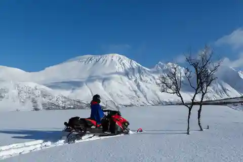 Tromsø: Lyngen Alps Snowmobile Safari with Lunch