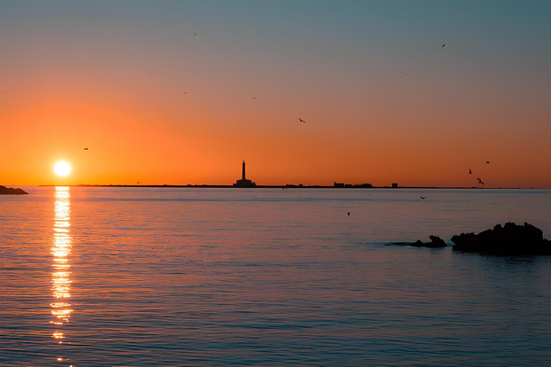 Puesta de sol en la isla de S. Andrea Gallipoli - Con aperitivo.