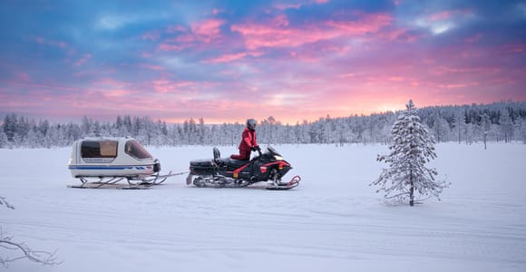 Rovaniemi: Family snowmobile safari with heated sleigh