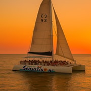 Lloret de Mar: Sunset Catamaran Cruise with DJ and Drinks