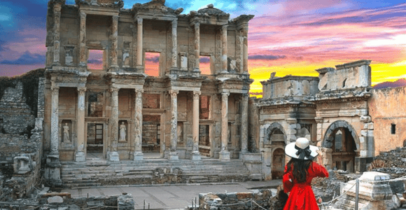 Marble columns and ancient paving at Ephesus beneath a clear Aegean sky