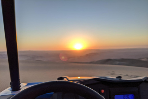 Paseo loco en buggy sandboarding y puesta de sol