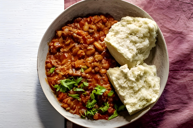 Zulu kook- en eetervaring met een plaatselijke chef-kokAM: Zulu voedsel kook- en eetervaring met een plaatselijke chef-kok