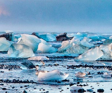 Tour di un giorno alla Diamond Beach e al Jökulsárlón con giro in barca