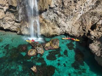 Nerja: Self-Guided Kayak Tour. Maro Waterfall. Support boat for the route.