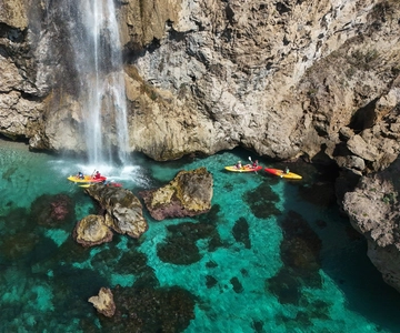 Nerja: Self-Guided Kayak Tour. Maro Waterfall. Support boat for the route.