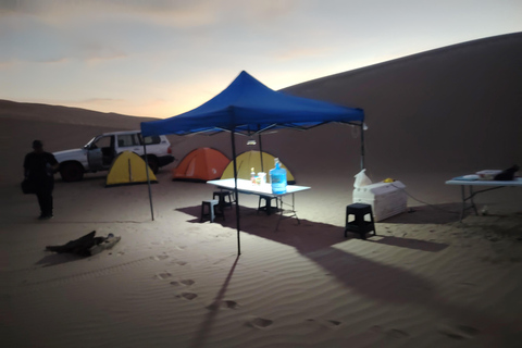Huacachina: Overnight Camping with Sandboarding/Sandsky, Bar, BBQ, and Campfire