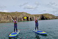 Pembrokeshire, Paddle Boarding en Tenby North Beach - Housity