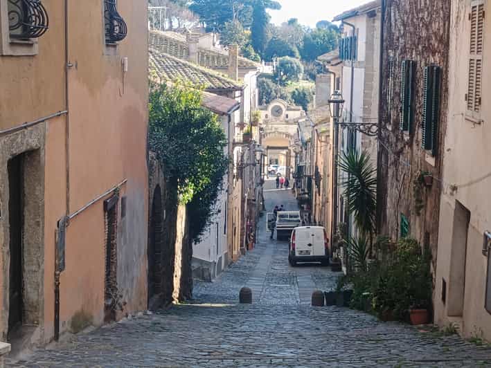 Discover Anguillara village, Lake Boat Tour and Sunset Swim