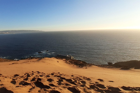 Sandboarding e pôr do sol nas dunas de ConconPôr do sol nas dunas de areia de Concon