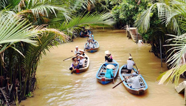 Visit Cu Chi tunnels and Mekong Delta 1 day - Small Group 11 pax in Cu Chi Tunnels & Mekong Delta