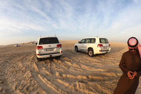 Depuis l'aéroport de Doha Demi-journée de safari dans le désert avec balade à dos de chameauDepuis l'aéroport de Doha Safari dans le désert d'une demi-journée avec promenade à dos de chameau