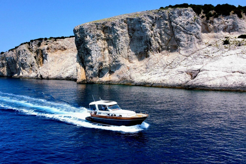 Capri Boat Tour with Caves, Swimming, Aperitif and Champagne From Capri: PRIVATE Capri Boat Tour
