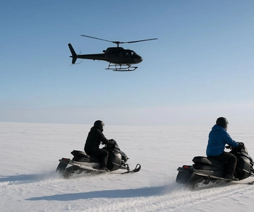 Sneeuwscooter met helikopter ervaring bij Langjokull