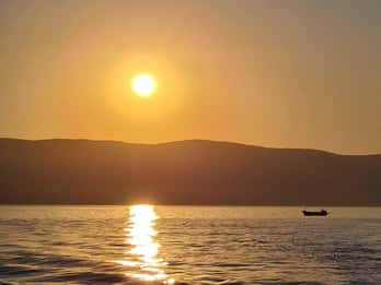 Krk: Private Sunset Cruise with Wine and Wild Beach Visit