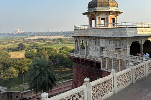 From Delhi: Sunrise Taj Mahal & Agra Fort Day Trip by AC Car Tour Guide Services Only