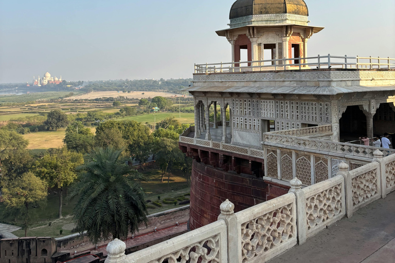From Delhi: Sunrise Taj Mahal & Agra Fort Day Trip by AC Car Tour Guide Services Only
