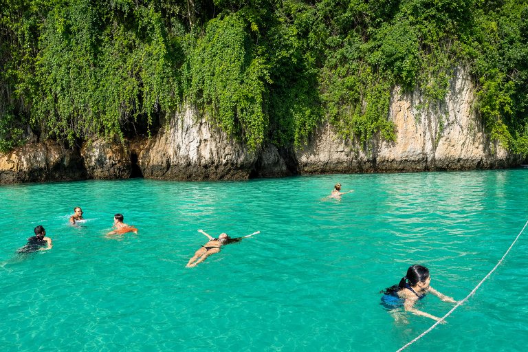 From Phi Phi: Iconic Bays by Longtail—Beach, Lagoon, Snorkel Phi Phi: Longtail Join Trip — Bays, Beach & Snorkeling
