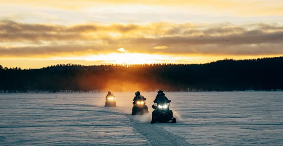 Explore Lake Inari by Snowmobiles