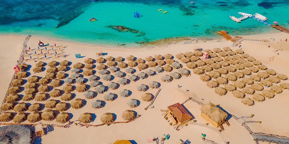 Guests relaxing on the Paradise Island beach